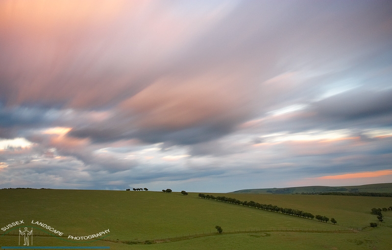 slides/Ditchling Beacon.jpg south downs nationl park,east sussex,clouds,sunset,movement,farm land,pasture,fence,trees,colourful Ditchling Beacon